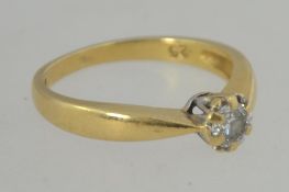 A 9ct gold and diamond single stone ladies ring.