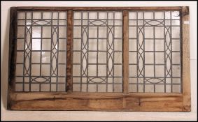 A large pine and leaded glass triptych window panel believed to be from an old pub / tavern