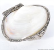 A silver white metal and mother of pearl purse,