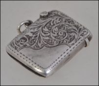 A silver hallmarked match vesta having a chased rococo design London assay marks makers marks for