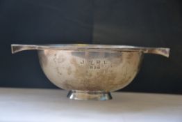 A silver hallmarked twin handled cup having assay marks for Sheffield,