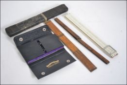 A collection of vintage 20th century rules and measures to include Prestons & Sons, Guinness,