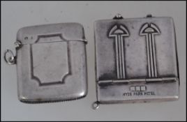 A vintage silver metal advertising match book holder for Hyde Park Hotel along with a silver