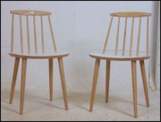 A pair of retro Mid Century Danish Modern spindle back Folke Palsson dining chairs having panel