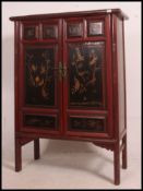 A good Japanese laquered marriage cabinet dating from the early to mid 20th century in red and