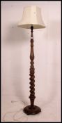 A good Victorian heavy mahogany large barley twist standard lamp raised on a terraced circular base.