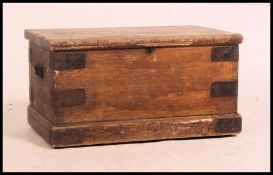 A Victorian pine and metal bound hinged top tool chest / blanket box.