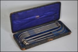 A cased set of unusual steel graduating medical tools in the original case with makers name to