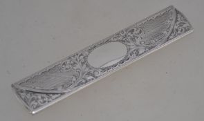 A Victorian silver hallmarked crochet hook case in the form of a spectacle case engraved with
