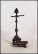 A Coalbrookdale style umbrella stand in cast iron with painted black finish,