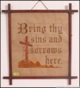 A framed and glazed religious needlepoint study with notation ' Bring thy sins and sorrows here '
