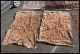 A pair of 20th century matching floor rugs / carpets each carpet having a green ground with