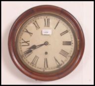 A Victorian mahogany cased circular station wall clock having roman numeral chapter ring with