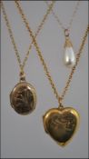 A collection of three 9ct gold necklaces to include two with lockets and the other having a drop