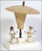 A stunning Kitsch mid century American made ceramic lamp having two Chinese ladies H57cm