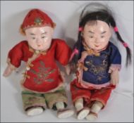 A duo of Japanese dolls from the mid 20th century , male and female ,