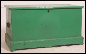 A Victorian painted pine large blanket box / chest trunk painted green having plinth base with