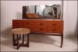 Ernst Gomme for G-Plan teak dressing chest, having single swing back over six drawers,
