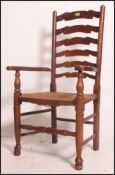 A heavy early 20th century north country oak ladderback Windsor type armchair /chair with rattan