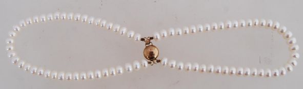 A good button pearl twin string bracelet