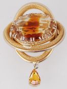 A large 1960's brooch which is gold tone