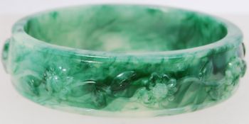 A plastic Jade effect moulded bangle. 2c
