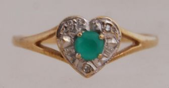 A 9ct gold set with a diamond halo round