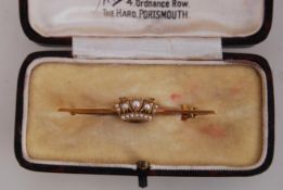 A boxed 14ct gold Naval bar brooch with