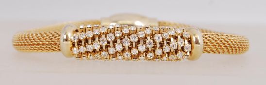 A good yellow metal woven chain bracelet