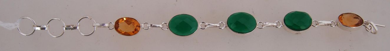 A 925 silver braclet with faceted green