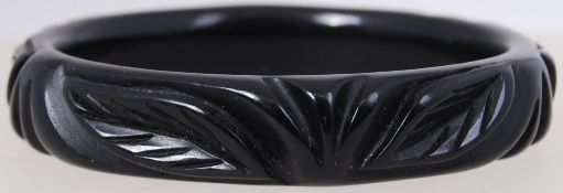 A vintage black Bakelite heavy carved ba