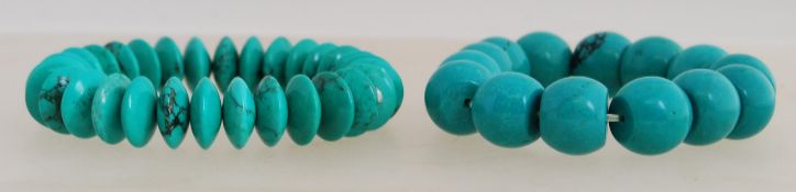 2 turquoise style stone bead bracelets.