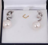 A pair of white metal rhodium plated dr