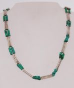 A white metal and malachite choker neckl