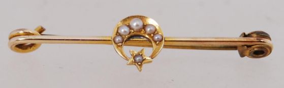 A yellow metal and seed pearl crescent m