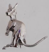 A vintage white metal figural brooch pin