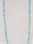 An aquamarine glass bead necklace. Measu