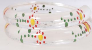 A 1950's reverse carved lucite wrap arou