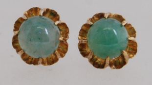 A pair of 9ct gold earrings with prong s