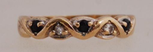 A 9ct gold ring set with sapphire and di