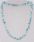 An blue green glass bead necklace. Measu