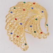 A large vintage brooch of a bird. Gold t