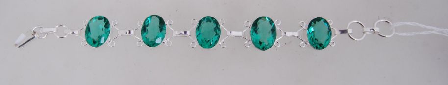 A 925 silver braclet with faceted green