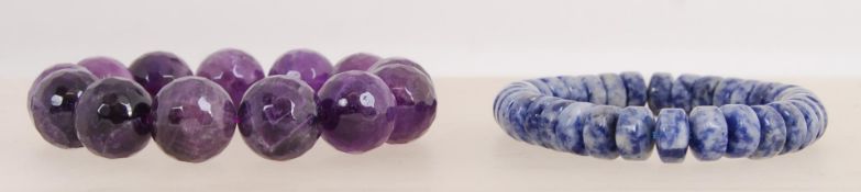 A purple faceted bead bracelet and a blu