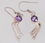 A pair of silver & amethyst drop earring