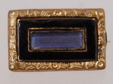 A Victorian mourning brooch with black e