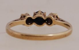 A 9ct gold diamond and sapphire trilogy