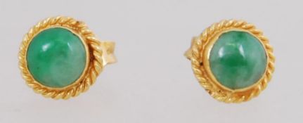 A pair of 18ct gold earrings set with gr