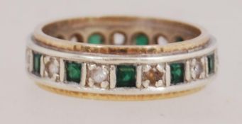 A 9ct gold band ring set with white and