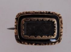 A 19th century mourning brooch with C cl
